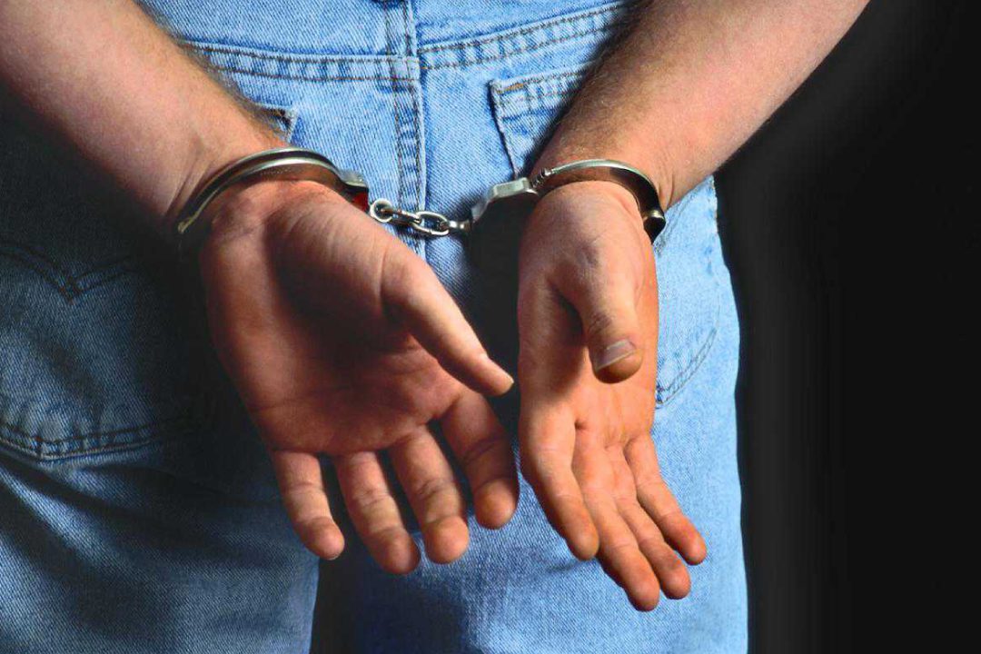 Man in handcuffs for criminal law